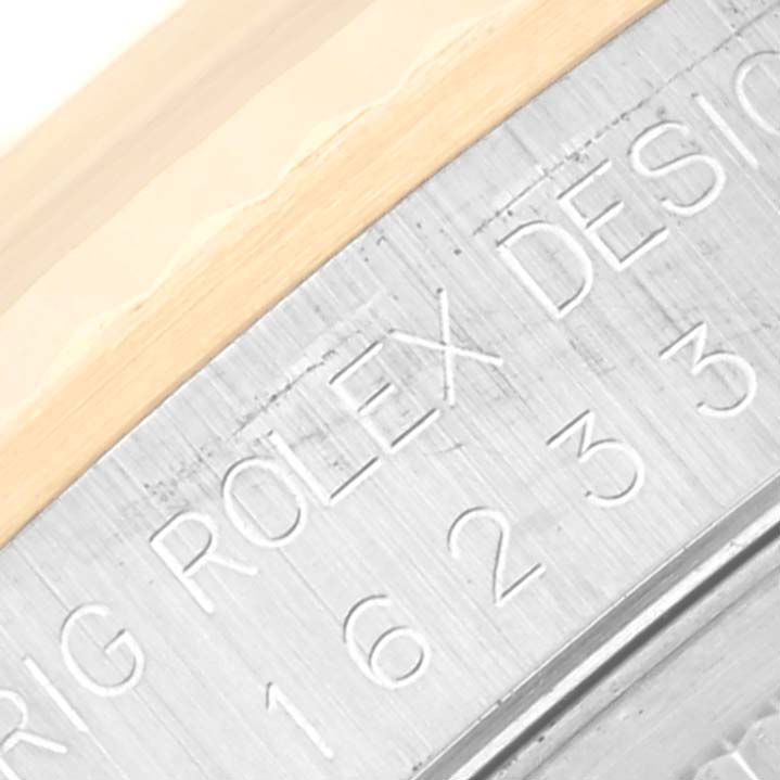 This image shows a close-up of the bezel and engraved rehaut of the Rolex Datejust 16233 Men's Steel and Gold (two tone) Champagne Dial 16233 Men's Steel and Gold (two tone) Champagne Dial watch.