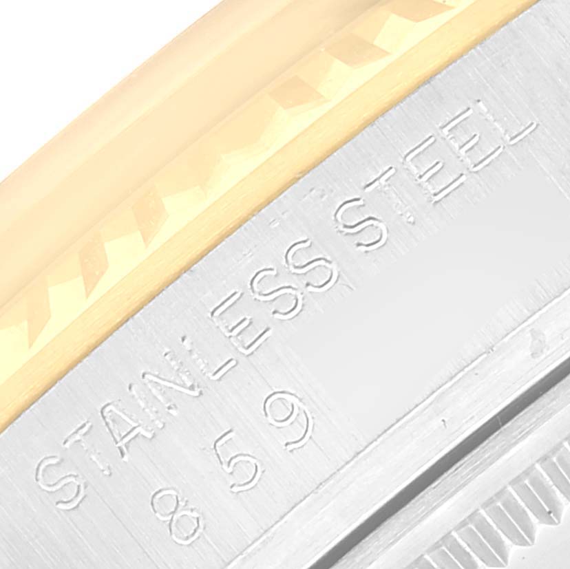 This close-up image shows the engraved "STAINLESS STEEL" text and part of the bezel detail on the Rolex Vintage Collection 16013 Men's Steel and Gold (two tone) Champagne Dial 16013 Men's Steel and Gold (two tone) Champagne Dial model.