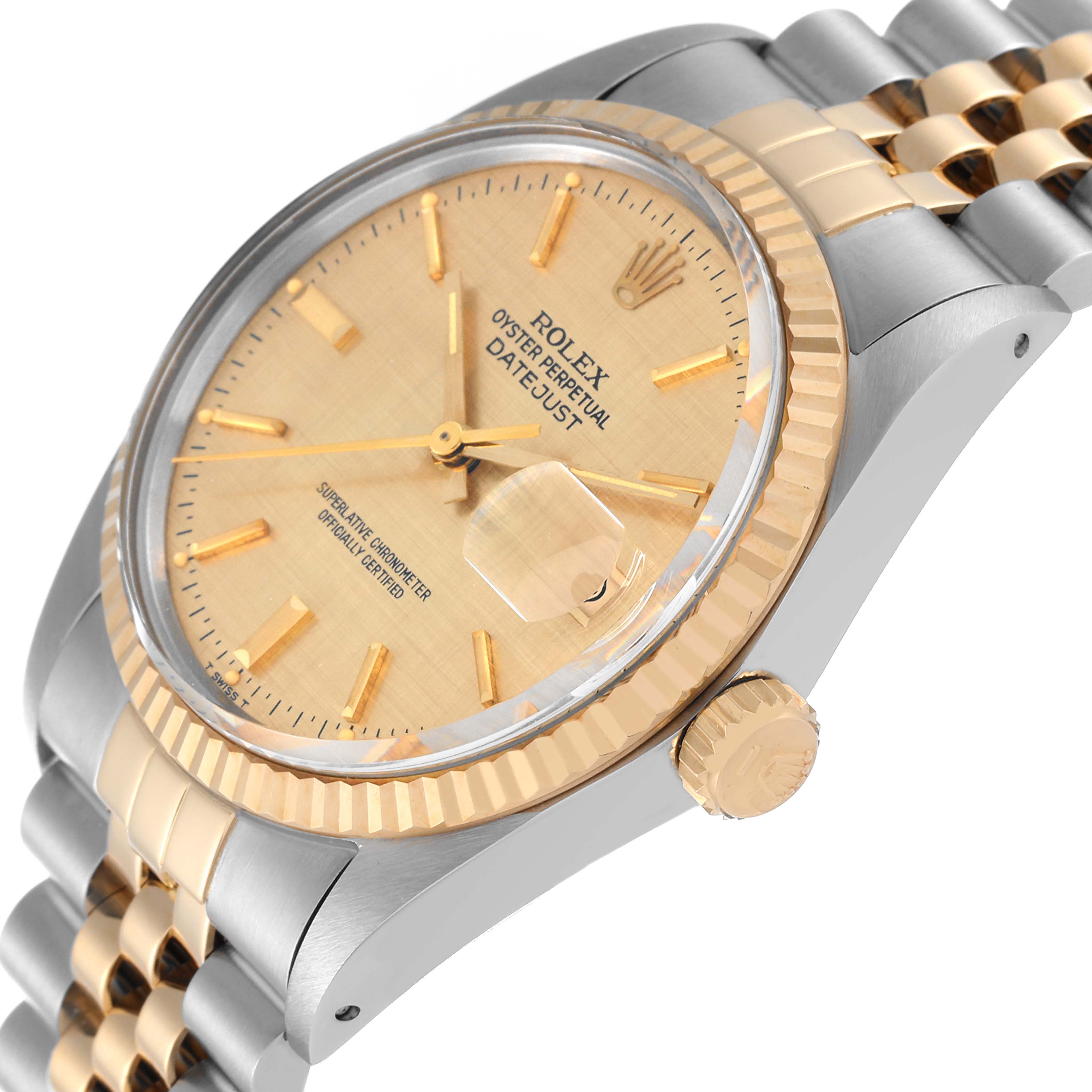 The Vintage Collection Rolex Datejust watch is shown at an angled close-up, highlighting its gold-tone dial, bezel, and part of the bracelet.
