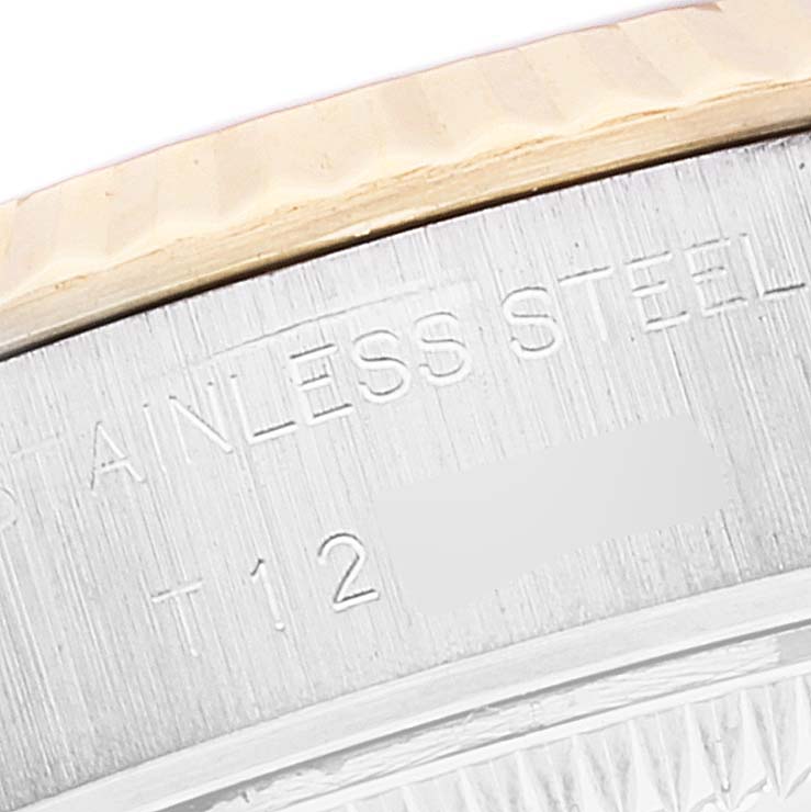 This close-up image shows the "Stainless Steel" engraving on the side of the bezel of a Rolex Datejust 69173 Women's Steel and Gold (two tone) Blue Dial 69173 Women's Steel and Gold (two tone) Blue Dial watch.