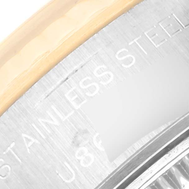 This close-up image of a Rolex Datejust 69173 Women's Steel and Gold (two tone) Silver Dial 69173 Women's Steel and Gold (two tone) Silver Dial watch shows part of the case back with 'STAINLESS STEEL' engraving.