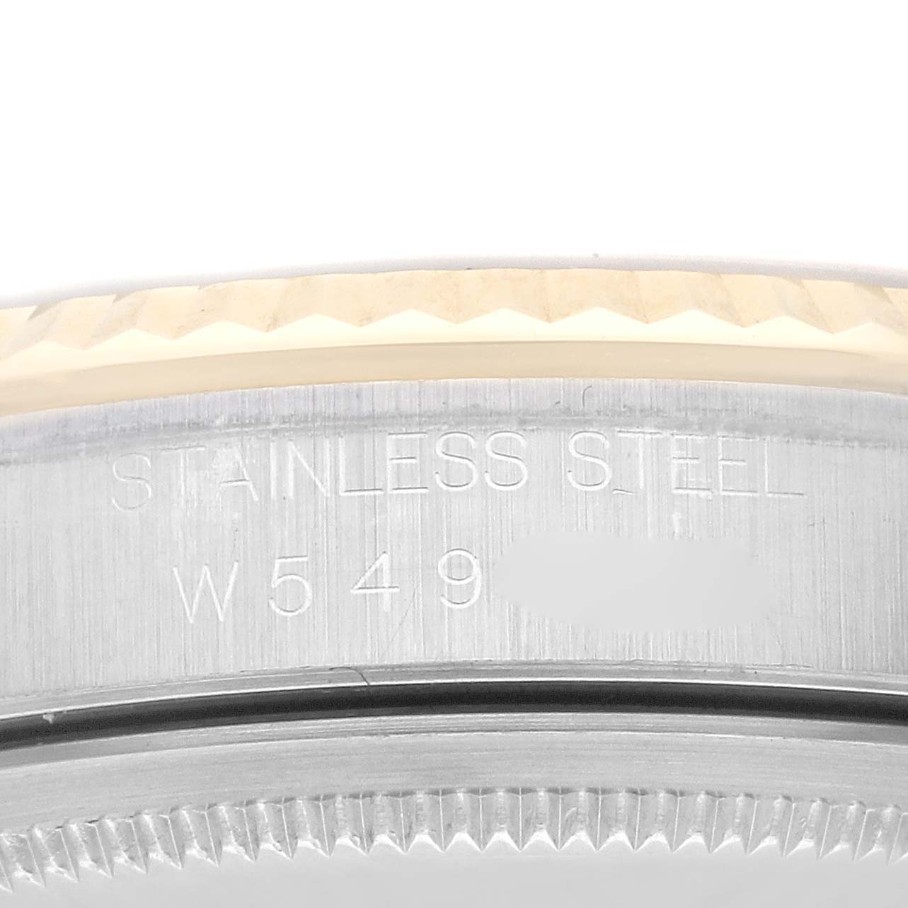 This image shows a close-up view of the bezel and the stainless steel case of a Rolex Datejust 16233 Men's Steel and Gold (two tone) Champagne Dial 16233 Men's Steel and Gold (two tone) Champagne Dial watch.