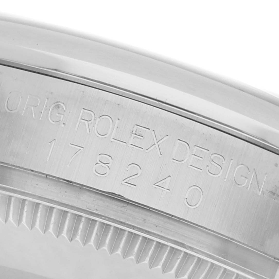 The image shows a close-up of the engraved side bezel of a Rolex Mid-Size 178240 Women's Stainless Steel Blue Dial 178240 Women's Stainless Steel Blue Dial watch, displaying the model number and branding.