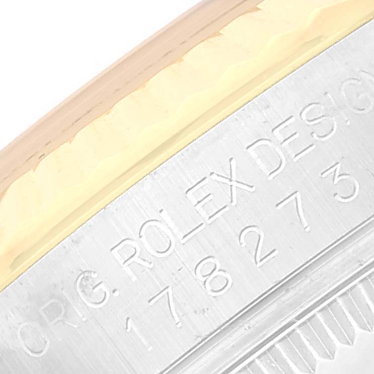 This image shows a close-up view of the side engraving on the case of a Rolex Mid-Size 178273 Women
s Steel and Gold (two tone) Grey Dial 178273 Women
s Steel and Gold (two tone) Grey Dial watch.