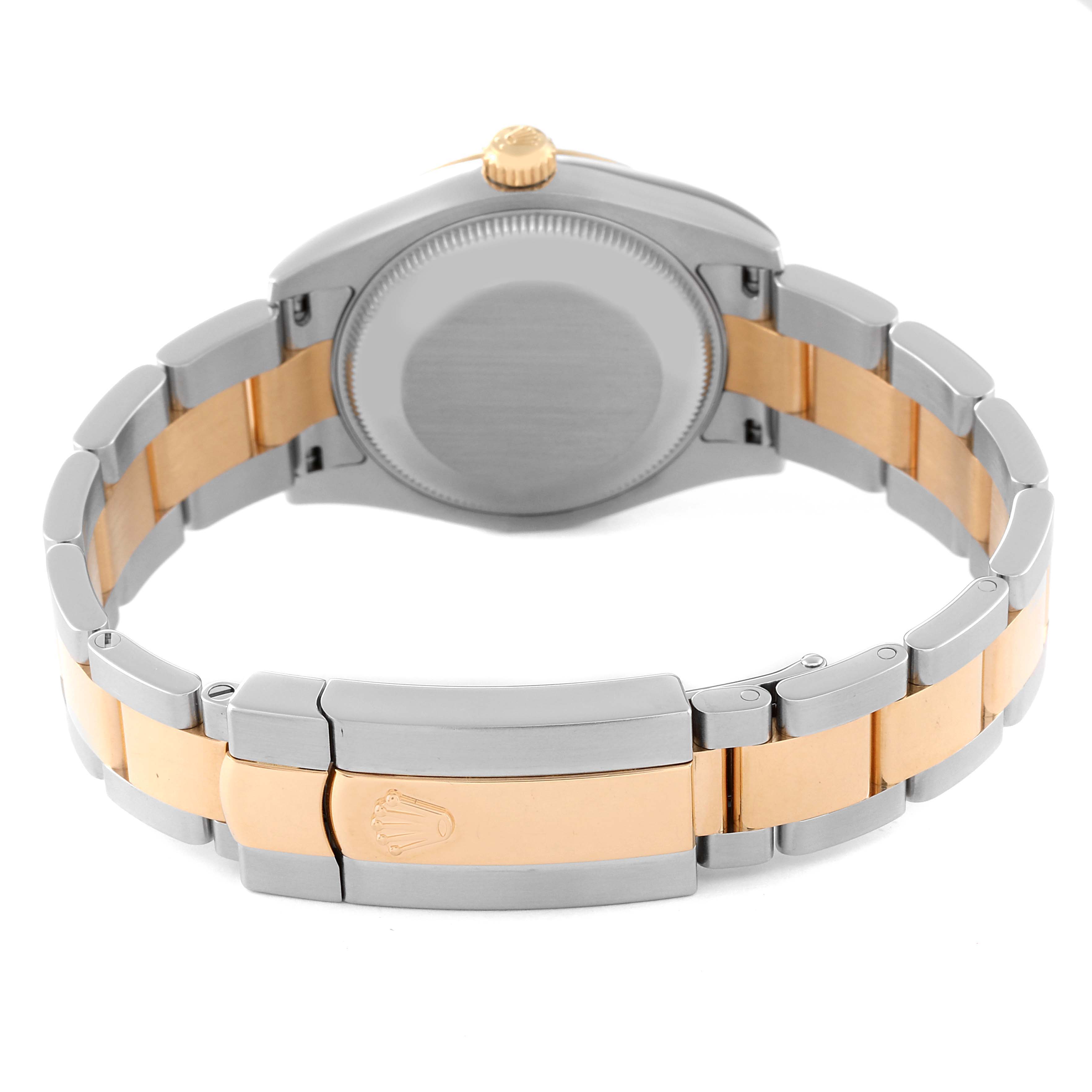 This image shows the back view of a Mid-Size Rolex watch, focusing on the watch case and two-tone bracelet.