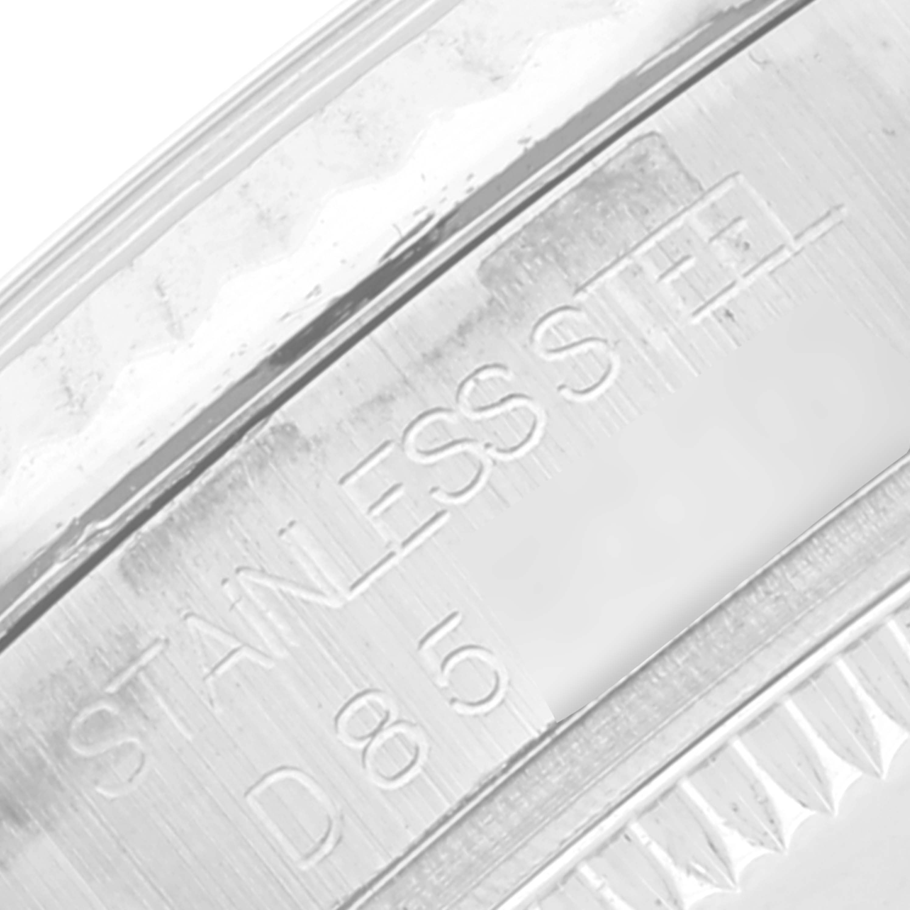 Close-up of the Rolex Mid-Size 178274 Women
s Stainless Steel Blue Dial 178274 Women
s Stainless Steel Blue Dial watch case side, showing "STAINLESS STEEL" engraving.