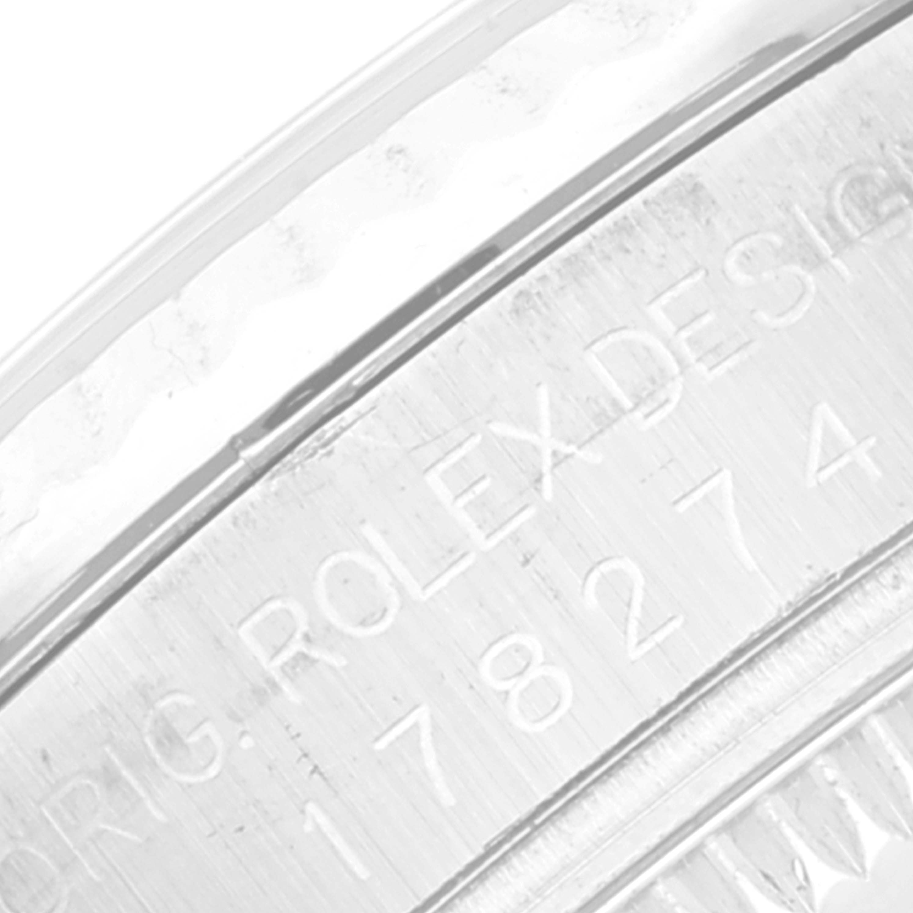 This is a close-up image of the side of a Rolex Mid-Size 178274 Women
s Stainless Steel Blue Dial 178274 Women
s Stainless Steel Blue Dial watch, showcasing the engraved model details.