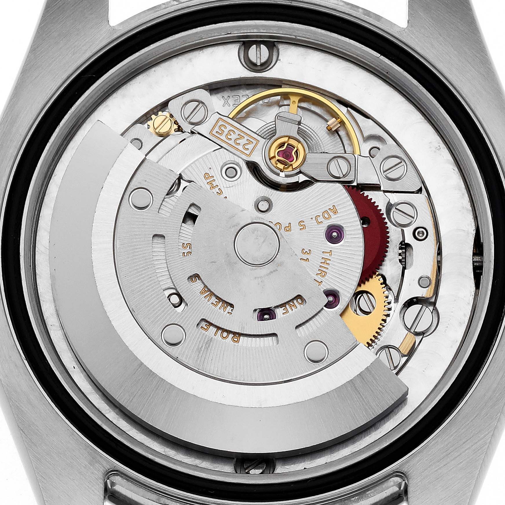 The image shows the internal mechanical movement of a Mid-Size Rolex watch at a close-up, rear angle.