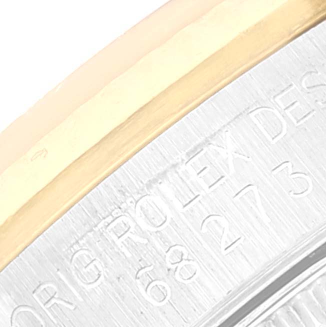 The image shows a close-up of the case back engraving on a Mid-Size Rolex watch.