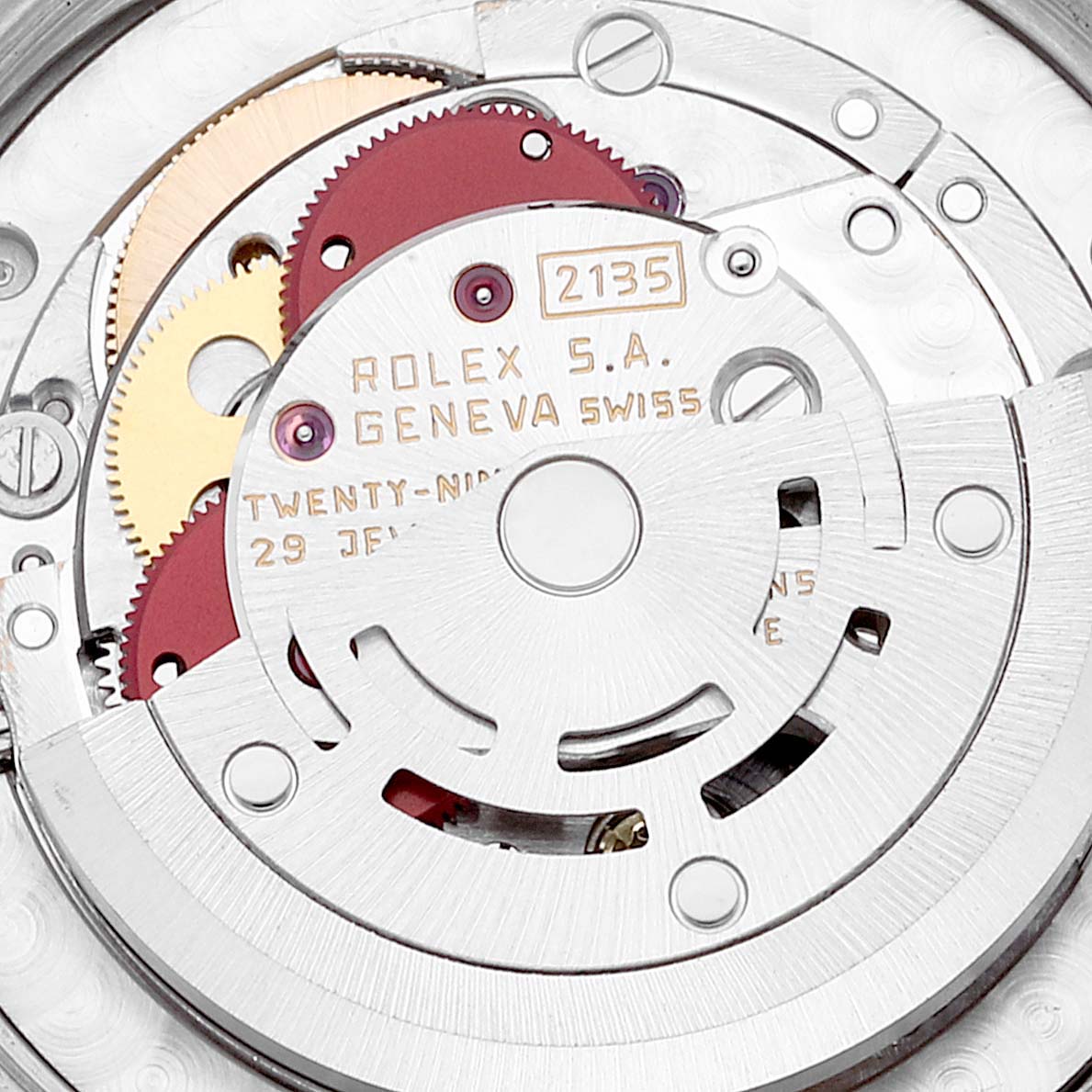 This image shows a close-up of the movement mechanism of a Rolex Mid-Size 68273 Women
s Steel and Gold (two tone) Black Dial 68273 Women
s Steel and Gold (two tone) Black Dial model, highlighting gears and engraved details.