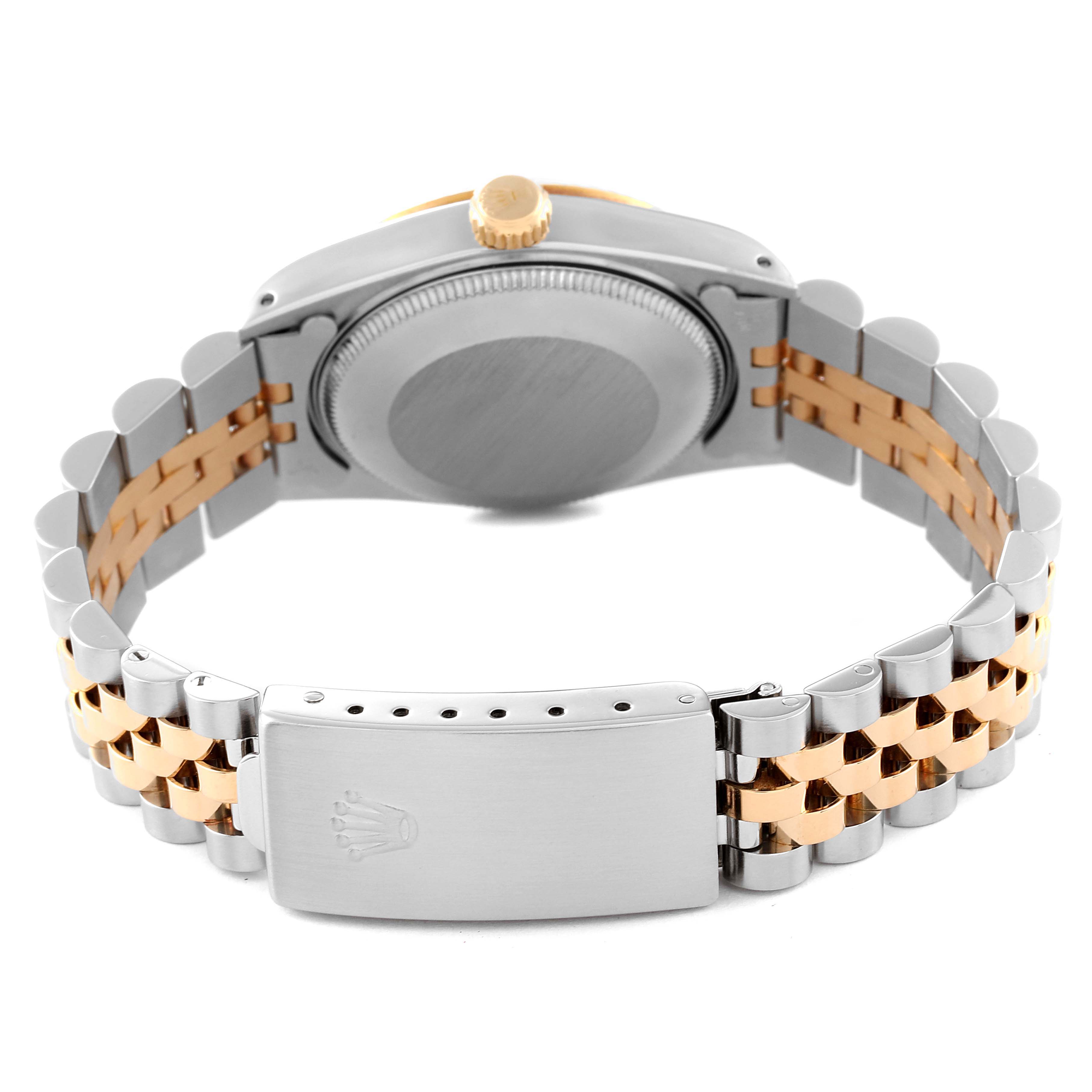 The image shows the back view of a Mid-Size Rolex watch, highlighting the bracelet, clasp, and caseback.