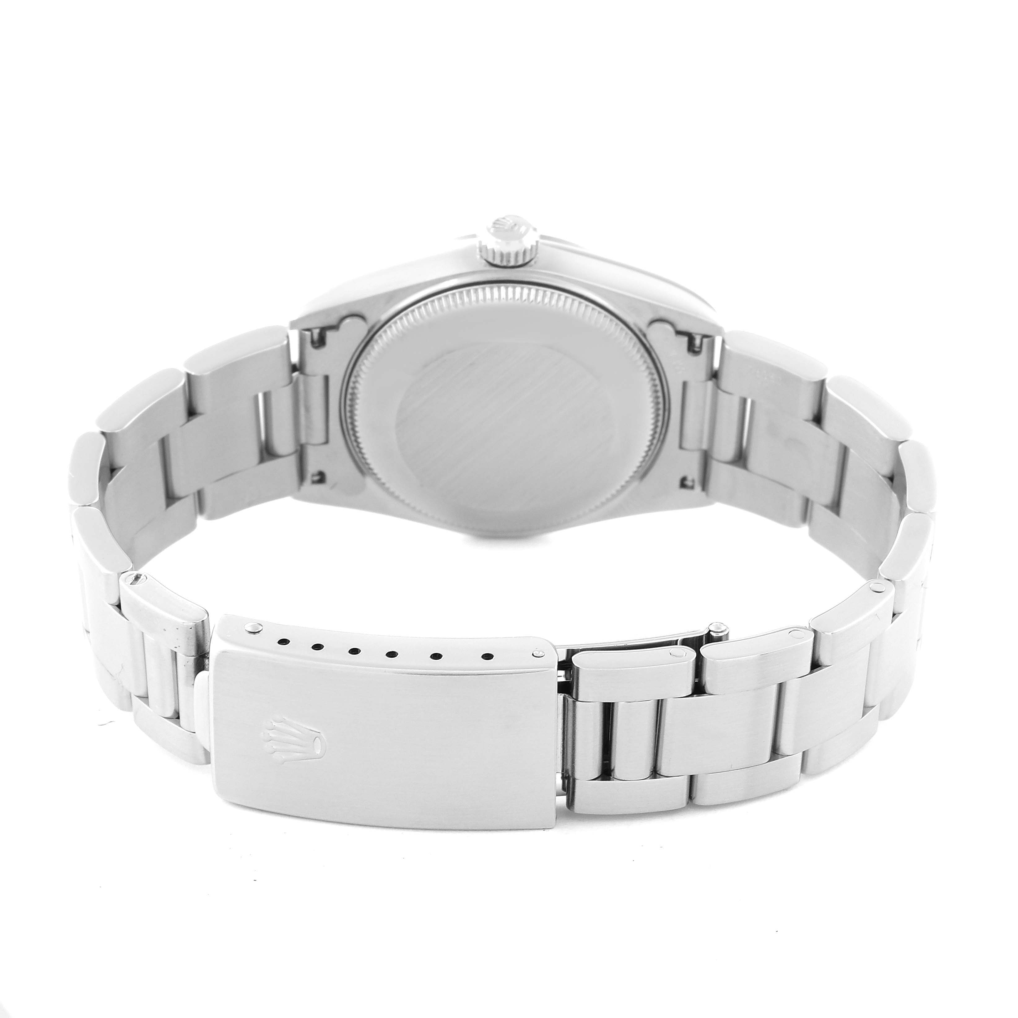 The image shows the back case and bracelet of a mid-size Rolex watch, focusing on the clasp and links.