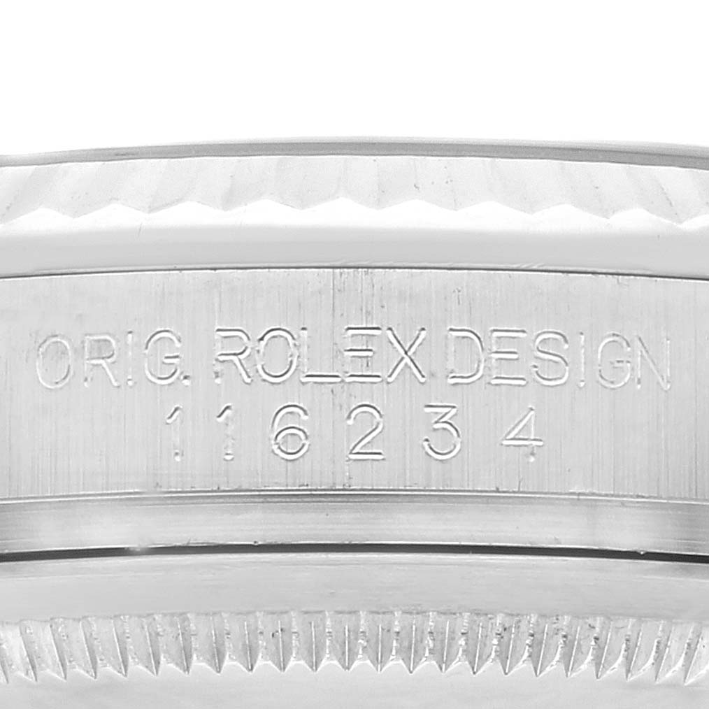 This image shows the engraved reference number and branding on the side of a Rolex Datejust 116234 Men's Stainless Steel Black Dial 116234 Men's Stainless Steel Black Dial watch case.