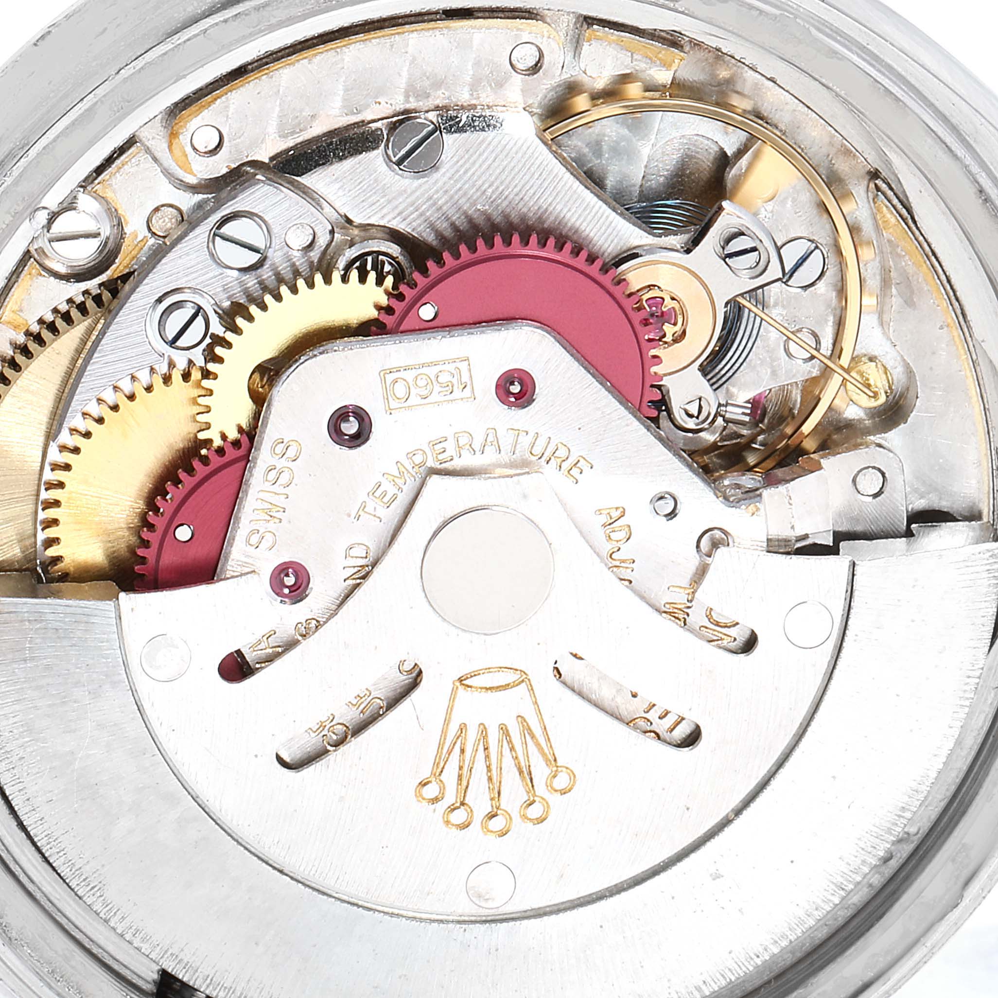 The image shows a close-up of the internal mechanism of a Rolex Vintage Collection 1601 Men
s Stainless Steel Silver Dial 1601 Men
s Stainless Steel Silver Dial watch, highlighting gears and intricate components.