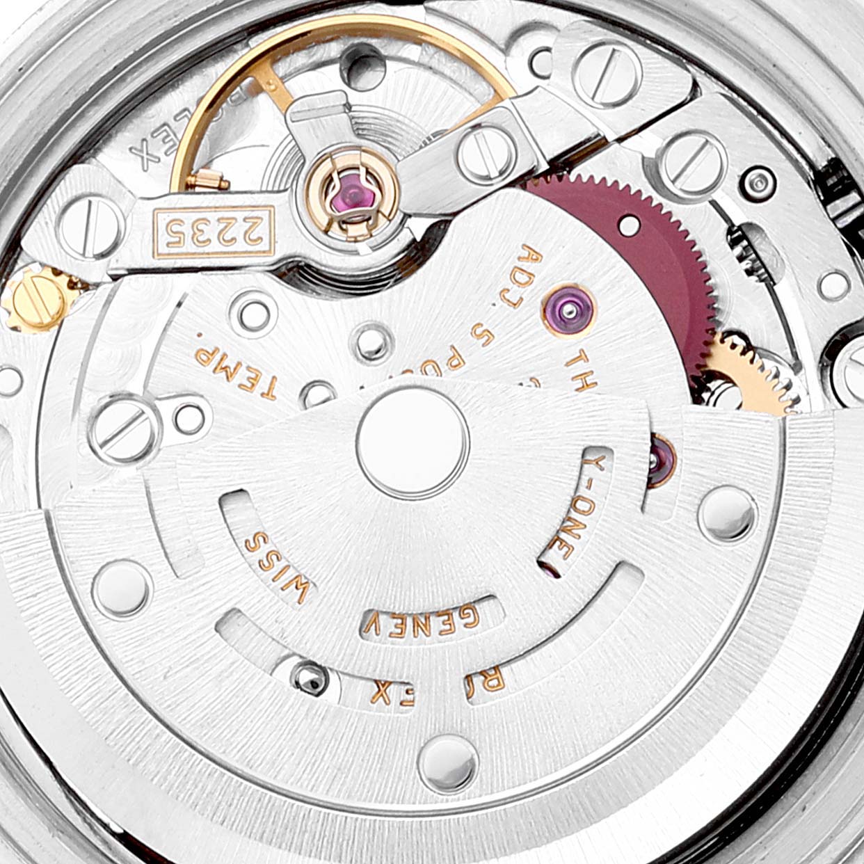 This image shows a macro view of the movement of a Rolex Datejust 179174 Women's Stainless Steel Pink Dial 179174 Women's Stainless Steel Pink Dial watch, highlighting intricate mechanical parts.