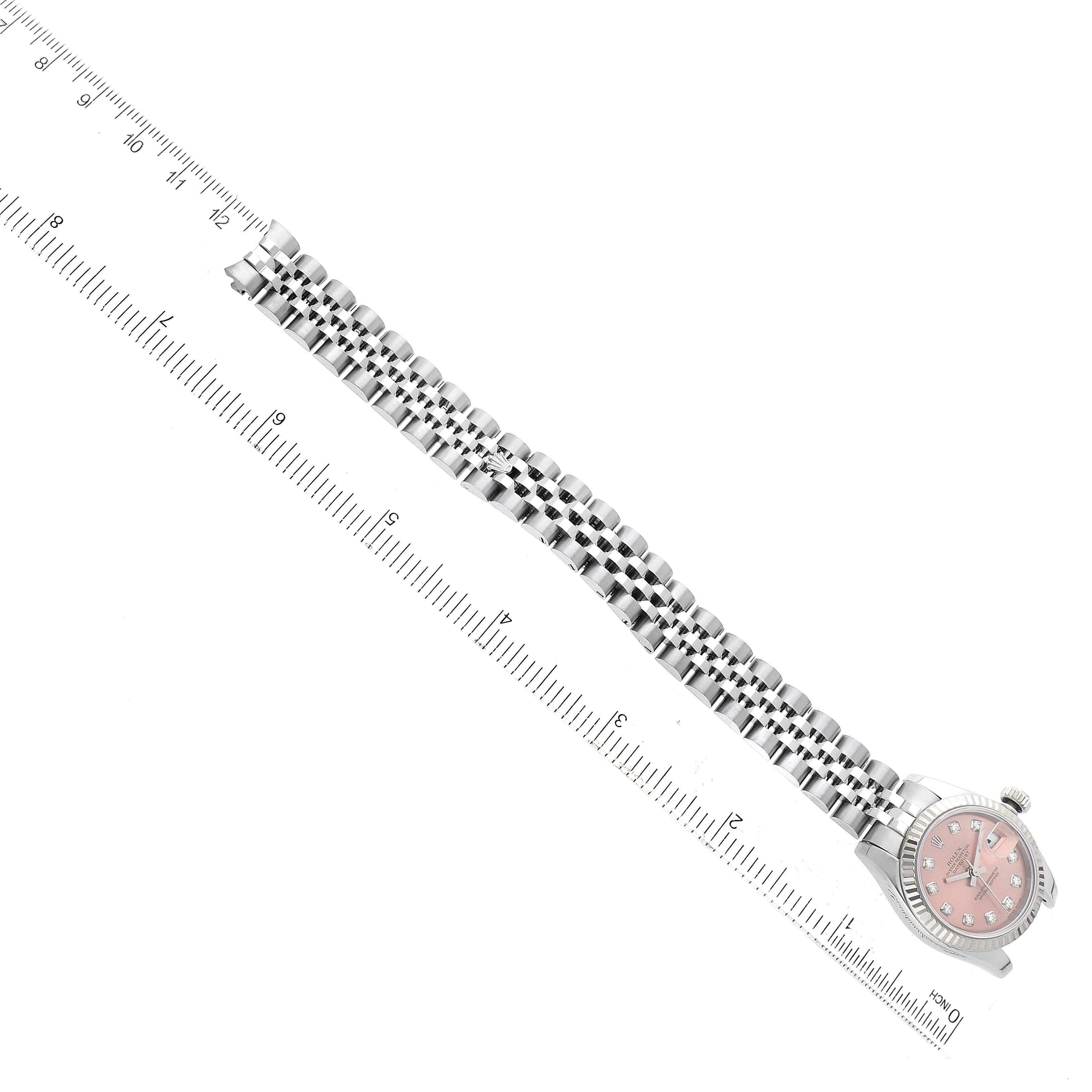 The image shows a Rolex Datejust 179174 Women's Stainless Steel Pink Dial 179174 Women's Stainless Steel Pink Dial watch flat from the dial to the bracelet, with the watch placed next to a measuring ruler.