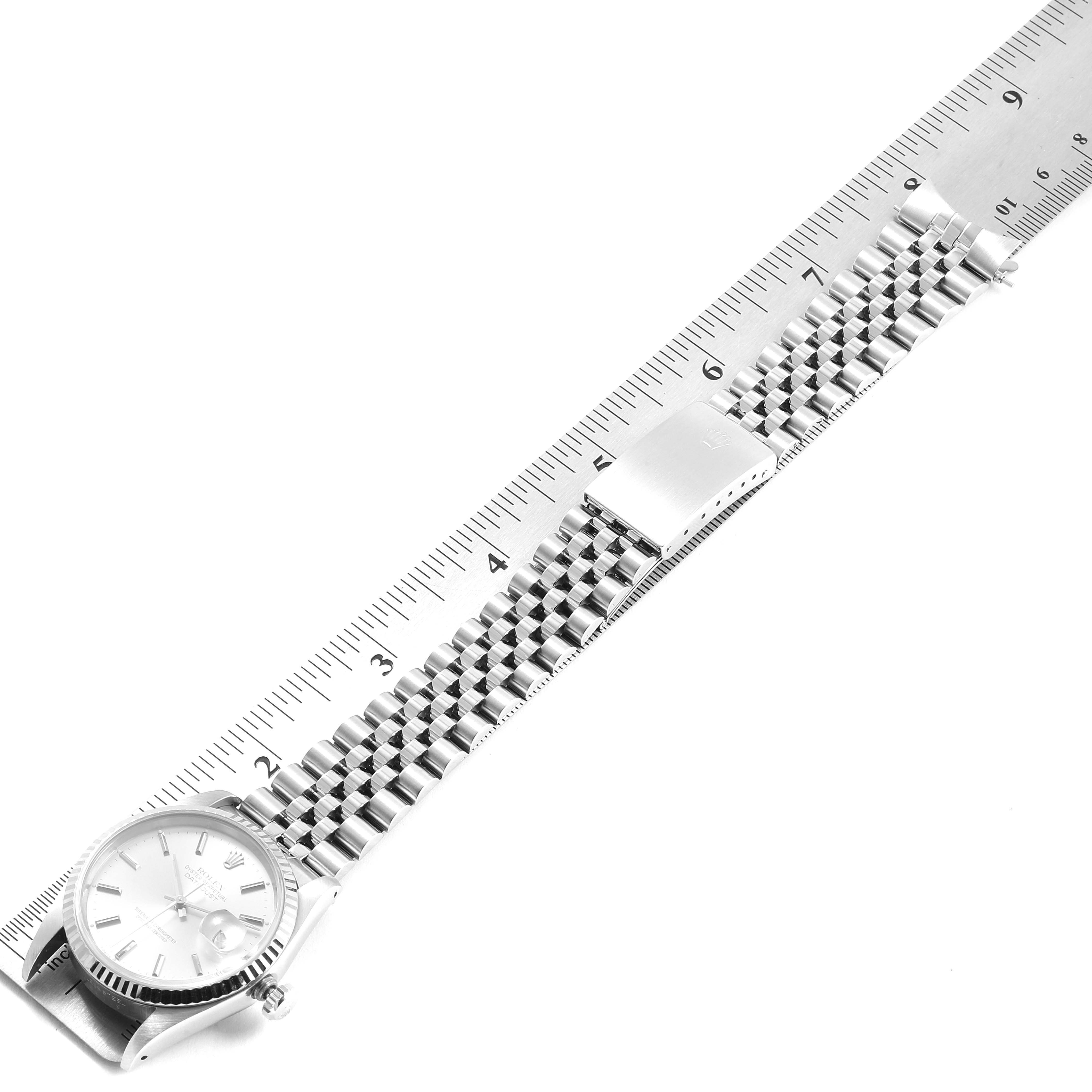 The image shows a Rolex Datejust 16234 Men's Stainless Steel Silver Dial 16234 Men's Stainless Steel Silver Dial watch laid flat, measured against a ruler with its face and bracelet visible.