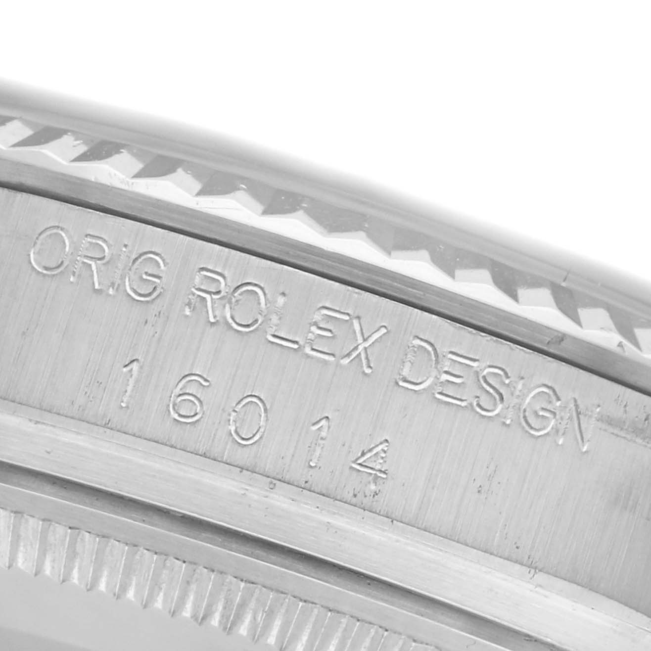 The image shows a close-up of the Rolex Datejust 16014 Men's Stainless Steel White Dial 16014 Men's Stainless Steel White Dial watch's case side, highlighting the engraved model number.