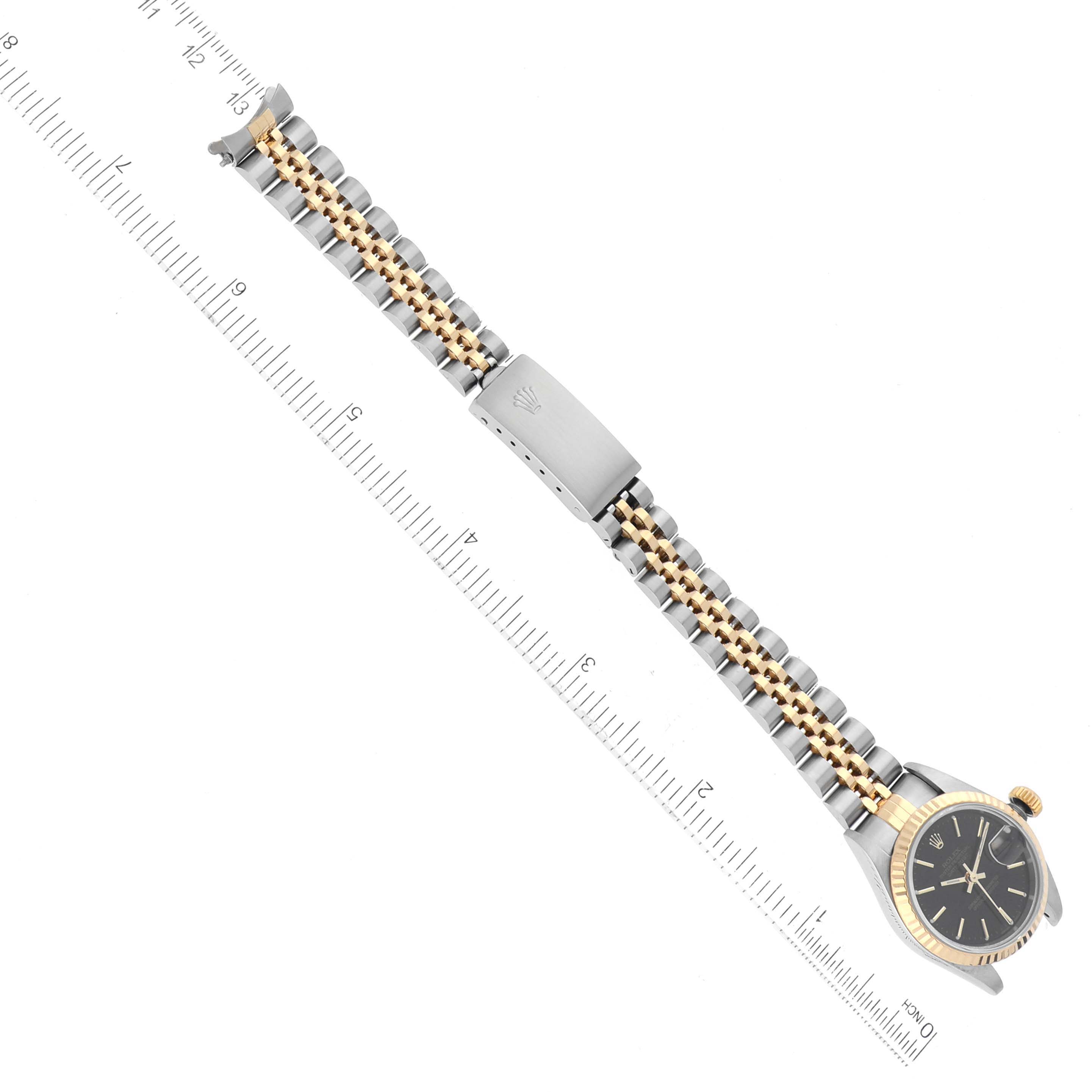This image shows a top-down view of a Rolex Datejust 79173 Women's Steel and Gold (two tone) Black Dial 79173 Women's Steel and Gold (two tone) Black Dial watch with focus on the bracelet and clasp.