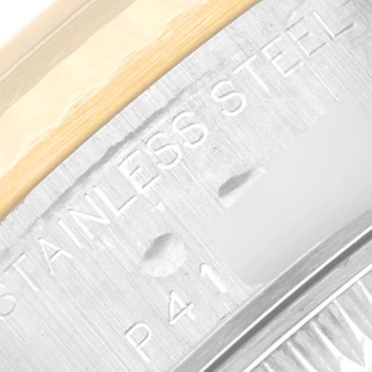 This close-up image shows the side case and part of the bezel of a Rolex Datejust 79173 Women's Steel and Gold (two tone) Black Dial 79173 Women's Steel and Gold (two tone) Black Dial watch, highlighting the "STAINLESS STEEL" engraving.