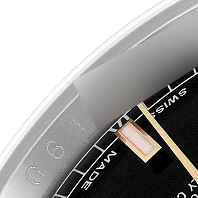 This image shows a close-up of the hour markers, hands, and part of the bezel of the Rolex Datejust 116233 Men's Steel and Gold (two tone) Black Dial 116233 Men's Steel and Gold (two tone) Black Dial watch.