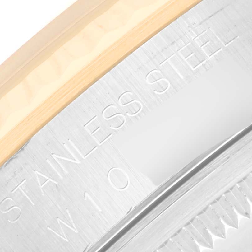 This close-up shows the engraved "Stainless Steel" text on the bezel of a Rolex Datejust 16233 Men's Steel and Gold (two tone) White Dial 16233 Men's Steel and Gold (two tone) White Dial watch.