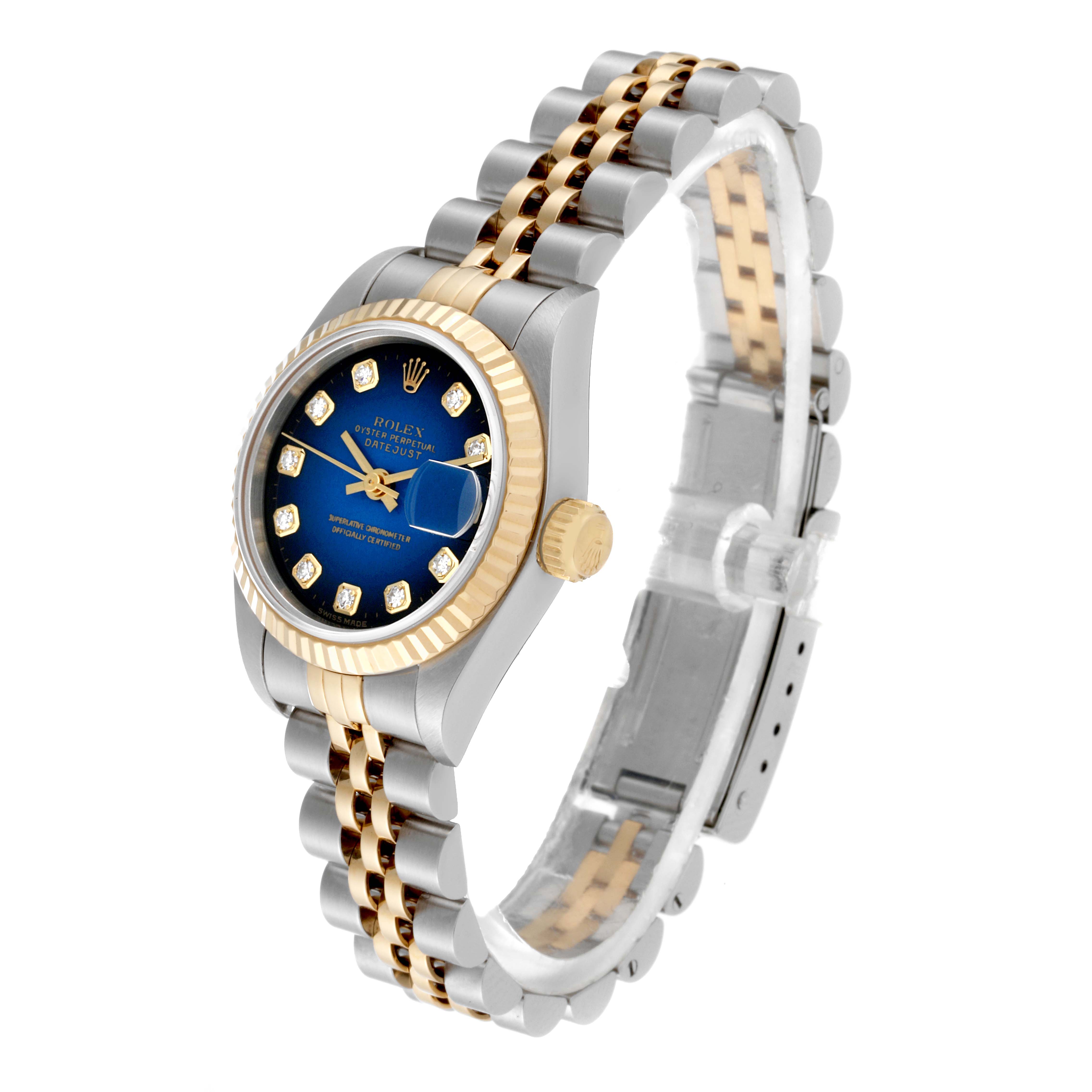 This Rolex Datejust 69173 Women's Steel and Gold (two tone) Blue Dial 69173 Women's Steel and Gold (two tone) Blue Dial watch is shown from an oblique angle, highlighting its dial, bezel, crown, and two-tone bracelet.