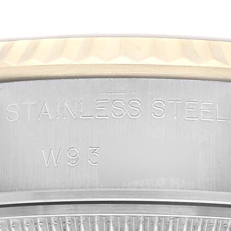 This image shows a close-up of the side of a Rolex Datejust 69173 Women's Steel and Gold (two tone) Blue Dial 69173 Women's Steel and Gold (two tone) Blue Dial's stainless steel case, highlighting its engraving.