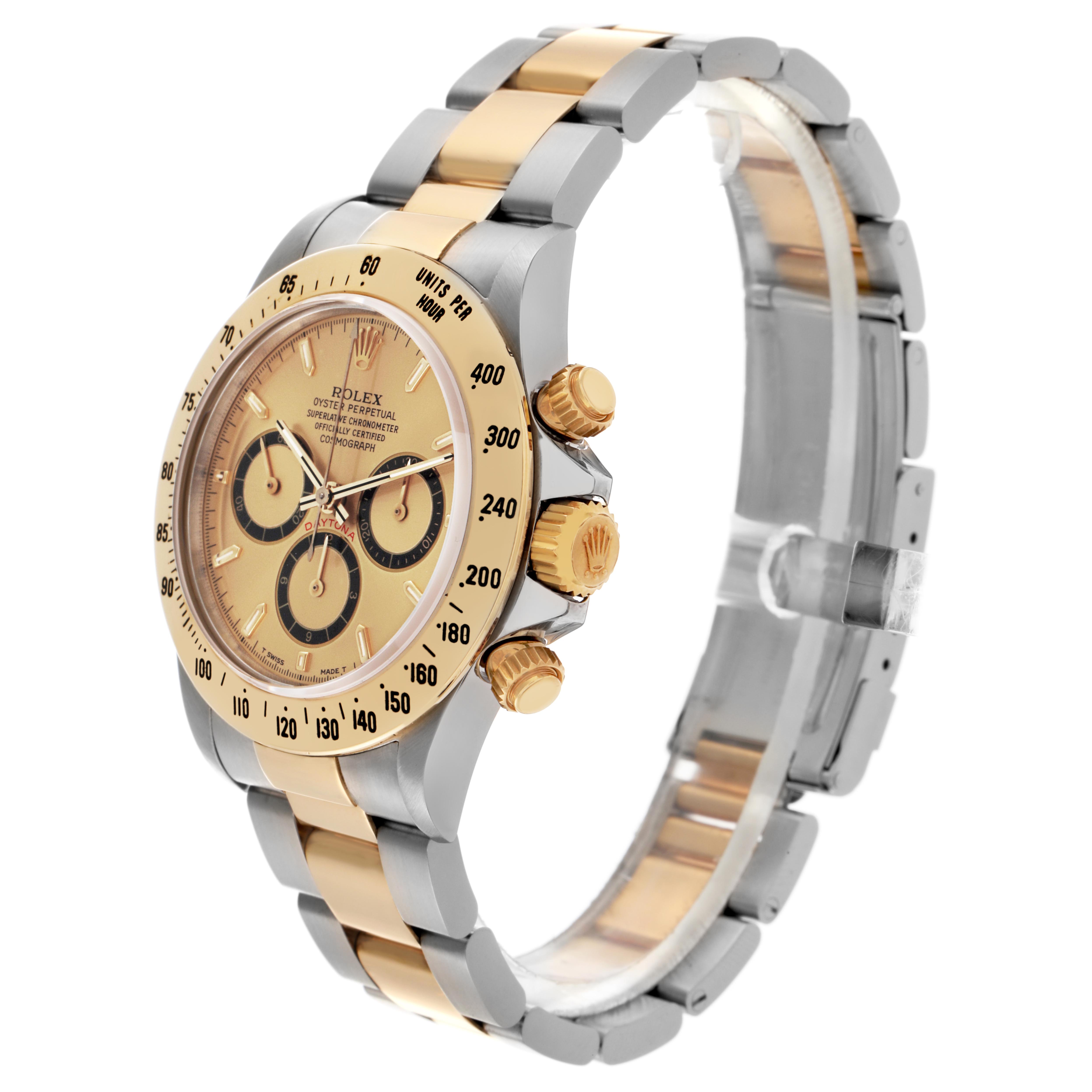 The Rolex Daytona 16523 Men's Steel and Gold (two tone) Champagne Dial 16523 Men's Steel and Gold (two tone) Champagne Dial watch is shown at a three-quarter angle, highlighting the bezel, dial, and bracelet.