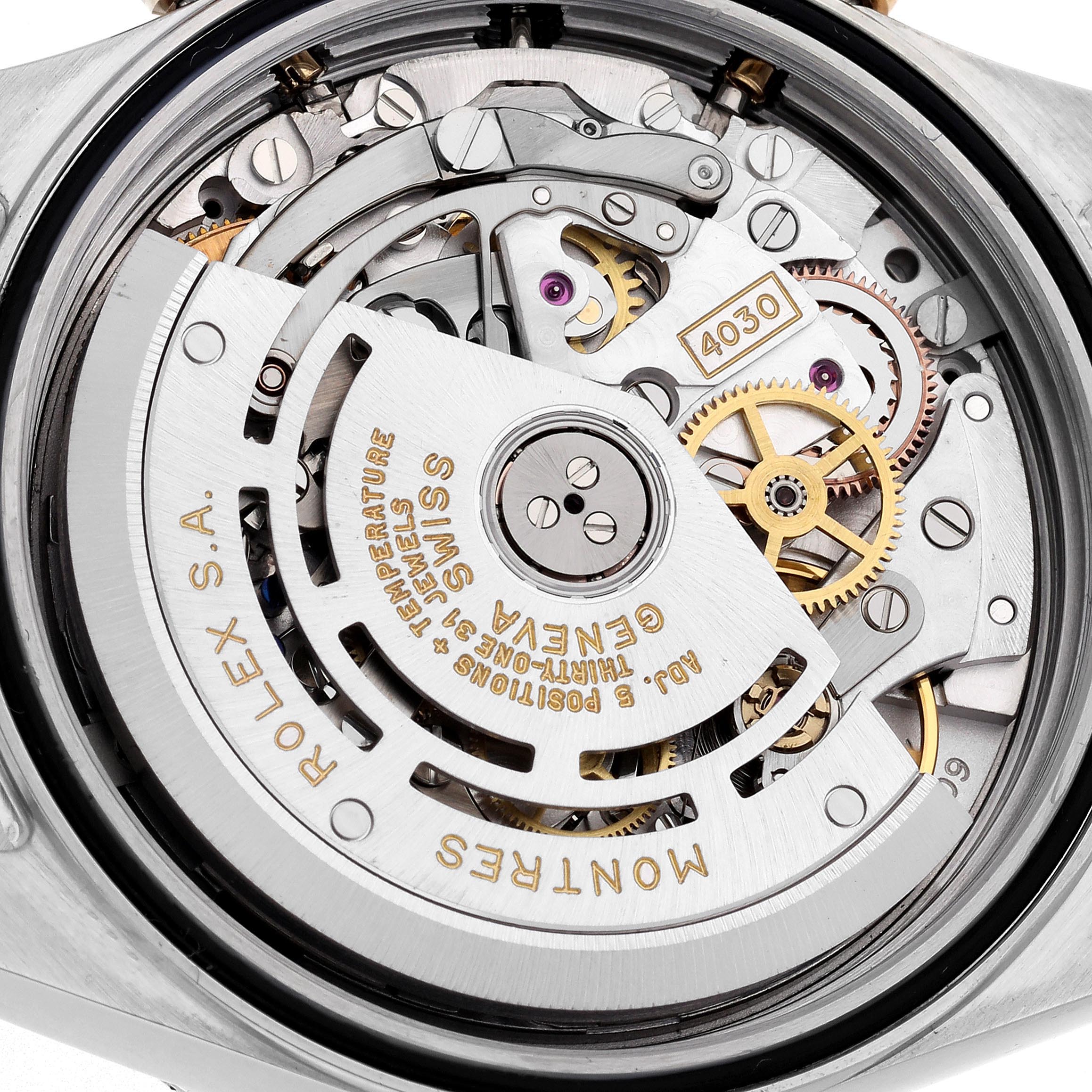 The image shows the movement of a Rolex Daytona 16523 Men's Steel and Gold (two tone) Champagne Dial 16523 Men's Steel and Gold (two tone) Champagne Dial watch from the back, highlighting gears and the rotor.