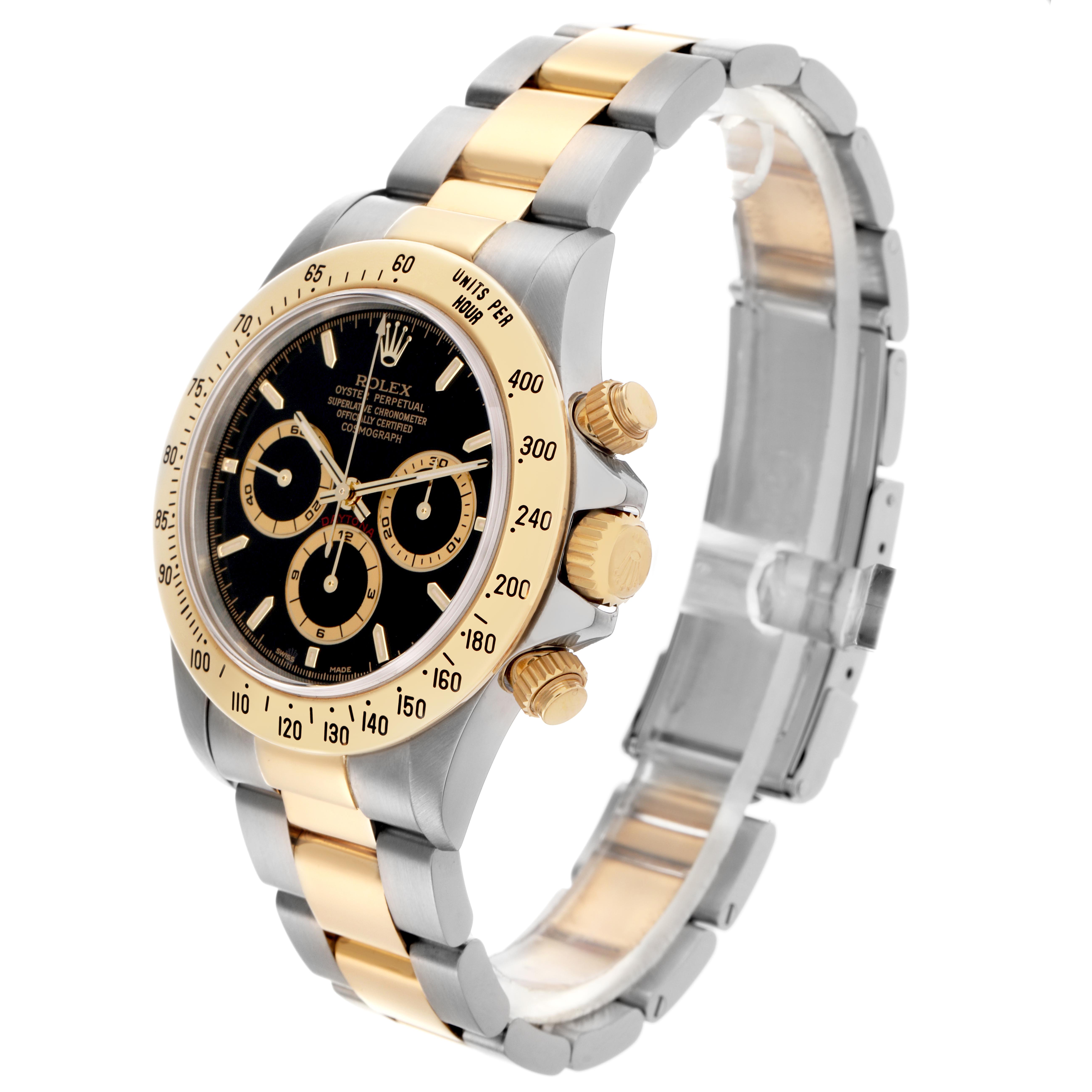 The Rolex Daytona 16523 Men's Steel and Gold (two tone) Black Dial 16523 Men's Steel and Gold (two tone) Black Dial watch is shown at a three-quarter angle, displaying the bezel, dial, sub-dials, crown, and bracelet.