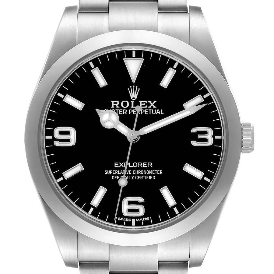 The Rolex Explorer is shown from the front, displaying its black dial, stainless steel case, and bracelet.