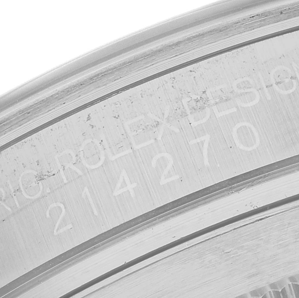 The image shows a close-up of the engraved bezel edge on a Rolex Explorer 214270 Men's Stainless Steel Black Dial 214270 Men's Stainless Steel Black Dial watch.