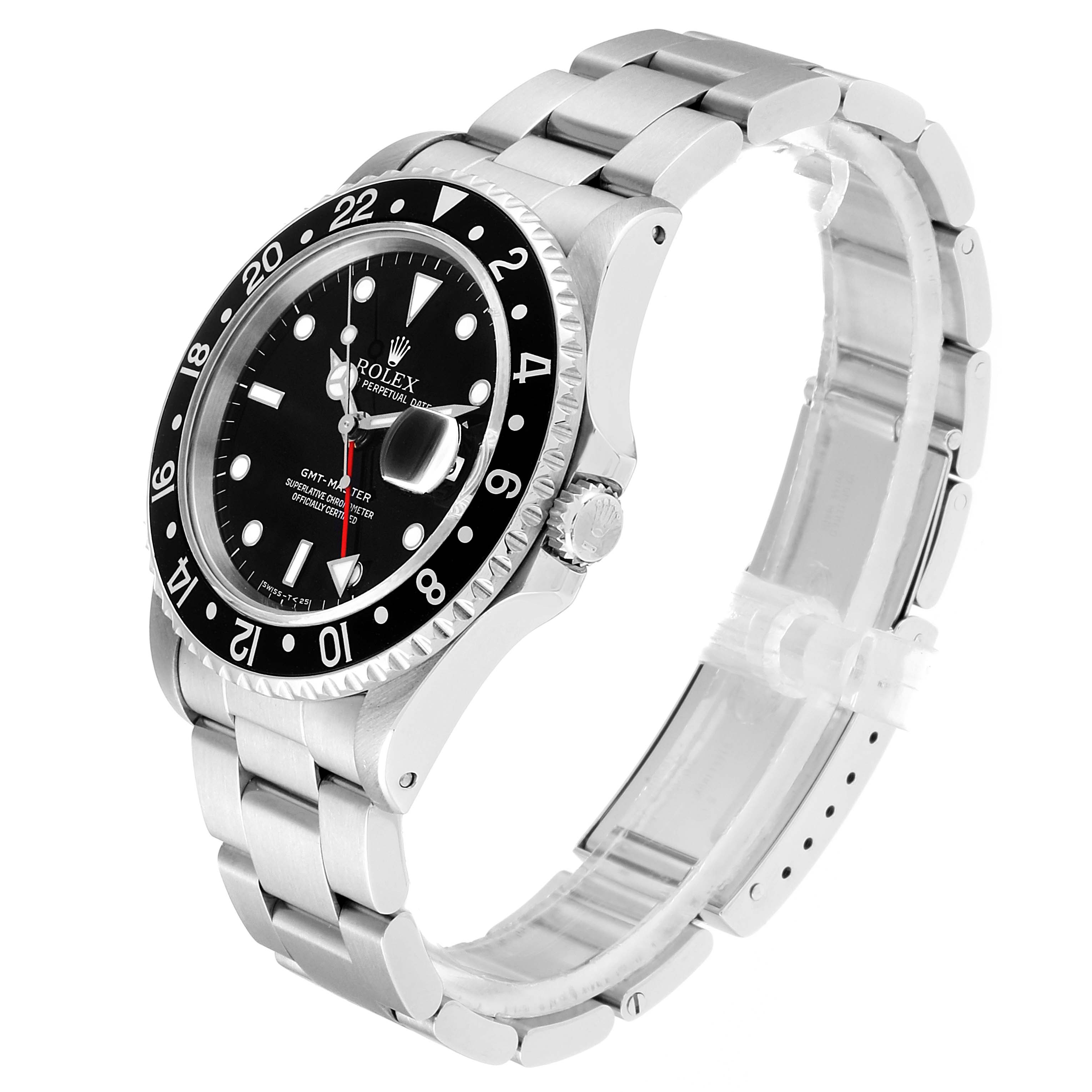 This image shows a Rolex GMT-Master 16700 Men
s Stainless Steel Black Dial 16700 Men
s Stainless Steel Black Dial watch at a three-quarter angle focusing on the face, bezel, and metal bracelet.