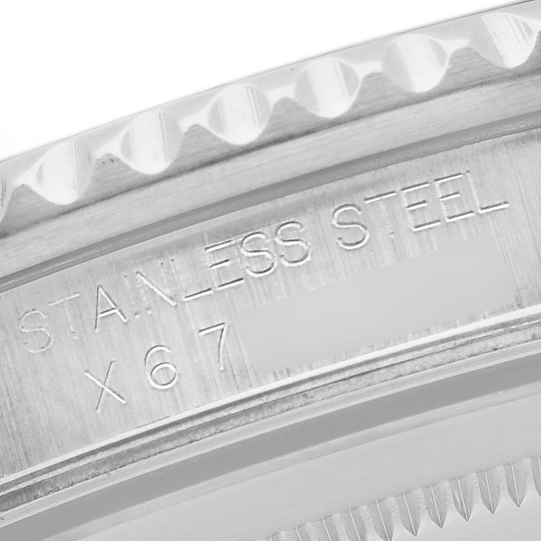 This close-up image shows the inscription "STAINLESS STEEL" on the case side of the Rolex GMT-Master 16710 Men
s Stainless Steel Black Dial 16710 Men
s Stainless Steel Black Dial watch.