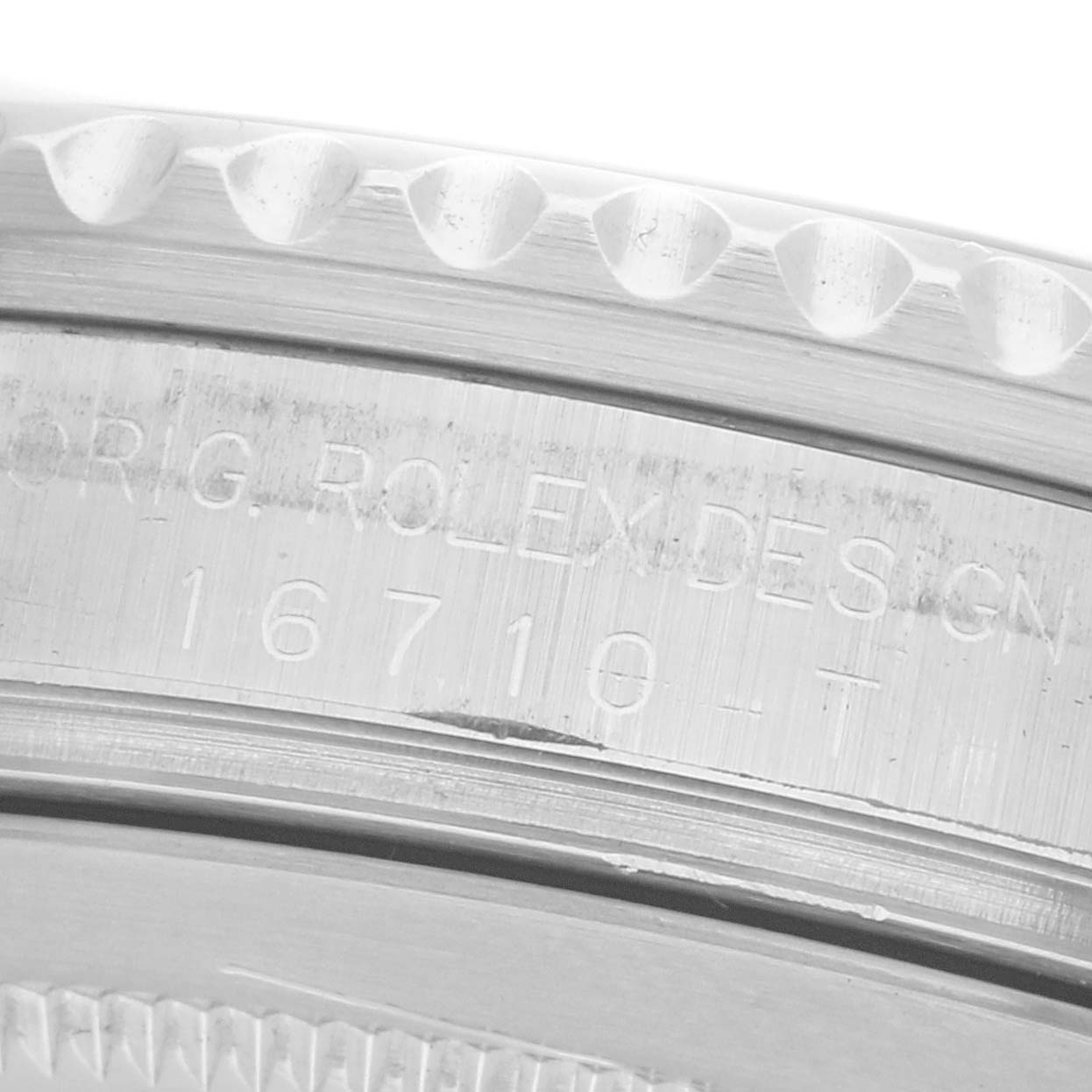 The image shows a side view of the Rolex GMT-Master 16710 Men's Stainless Steel Black Dial 16710 Men's Stainless Steel Black Dial's engraved case edge with model number 16710.