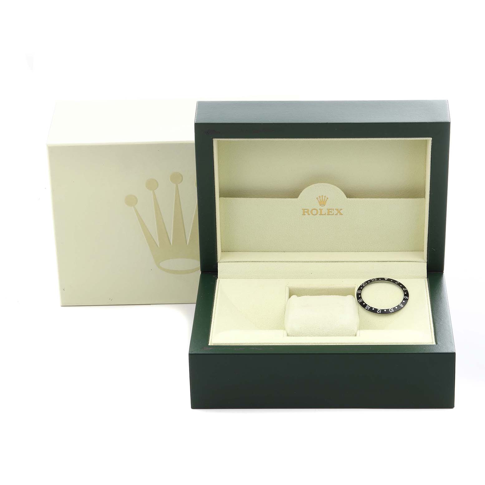 The image shows a Rolex box with the bezel of a GMT-Master, highlighting the exterior packaging and the bezel accessory.