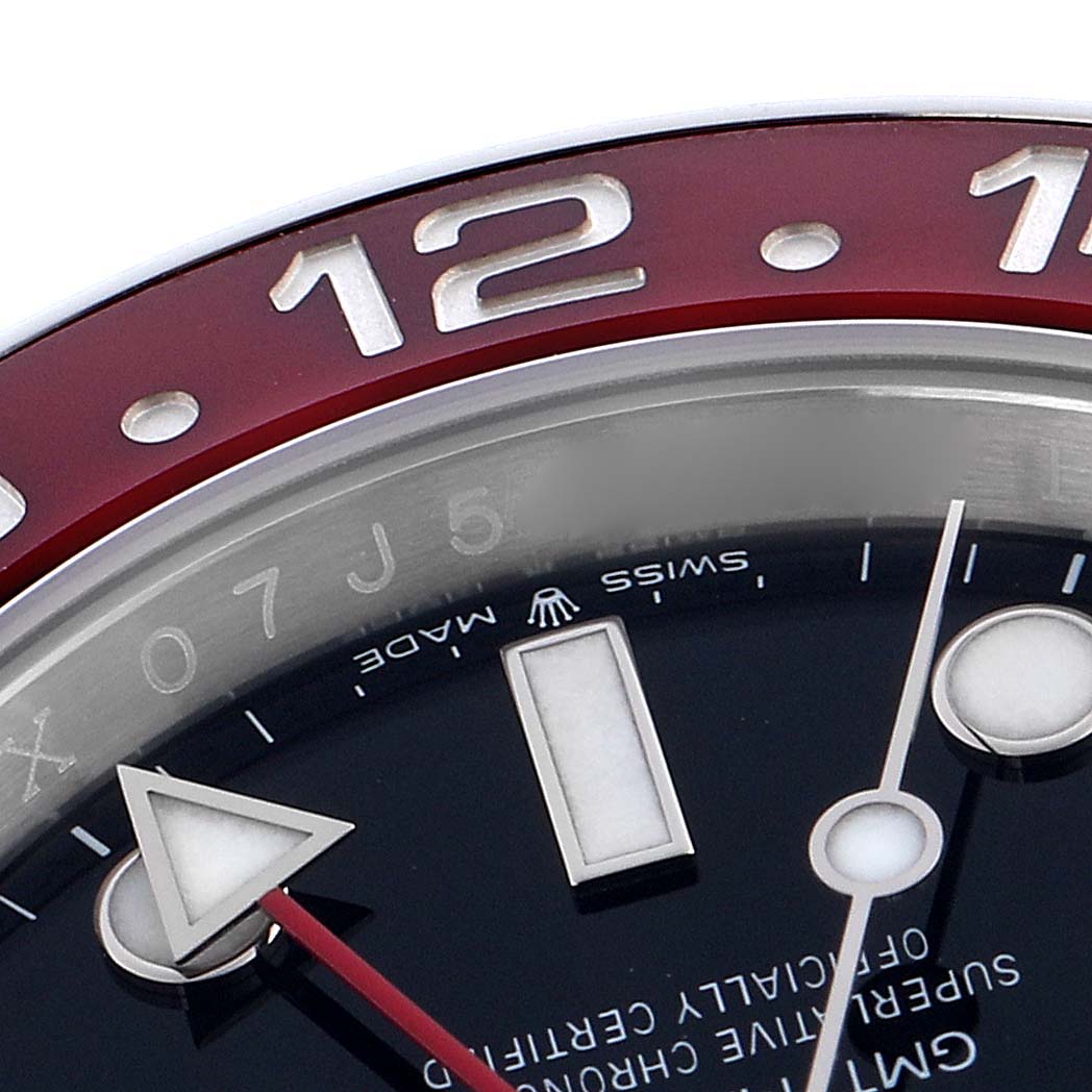 The image shows a close-up of the Rolex GMT-Master 126710BLRO Men's Stainless Steel Black Dial 126710BLRO Men's Stainless Steel Black Dial watch face, highlighting the bezel and hands.