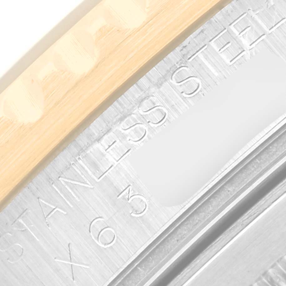 This image shows a close-up angle of the Rolex GMT-Master 16713 Men's Steel and Gold (two tone) Black Dial 16713 Men's Steel and Gold (two tone) Black Dial's case back edge, highlighting the engraved "STAINLESS STEEL".