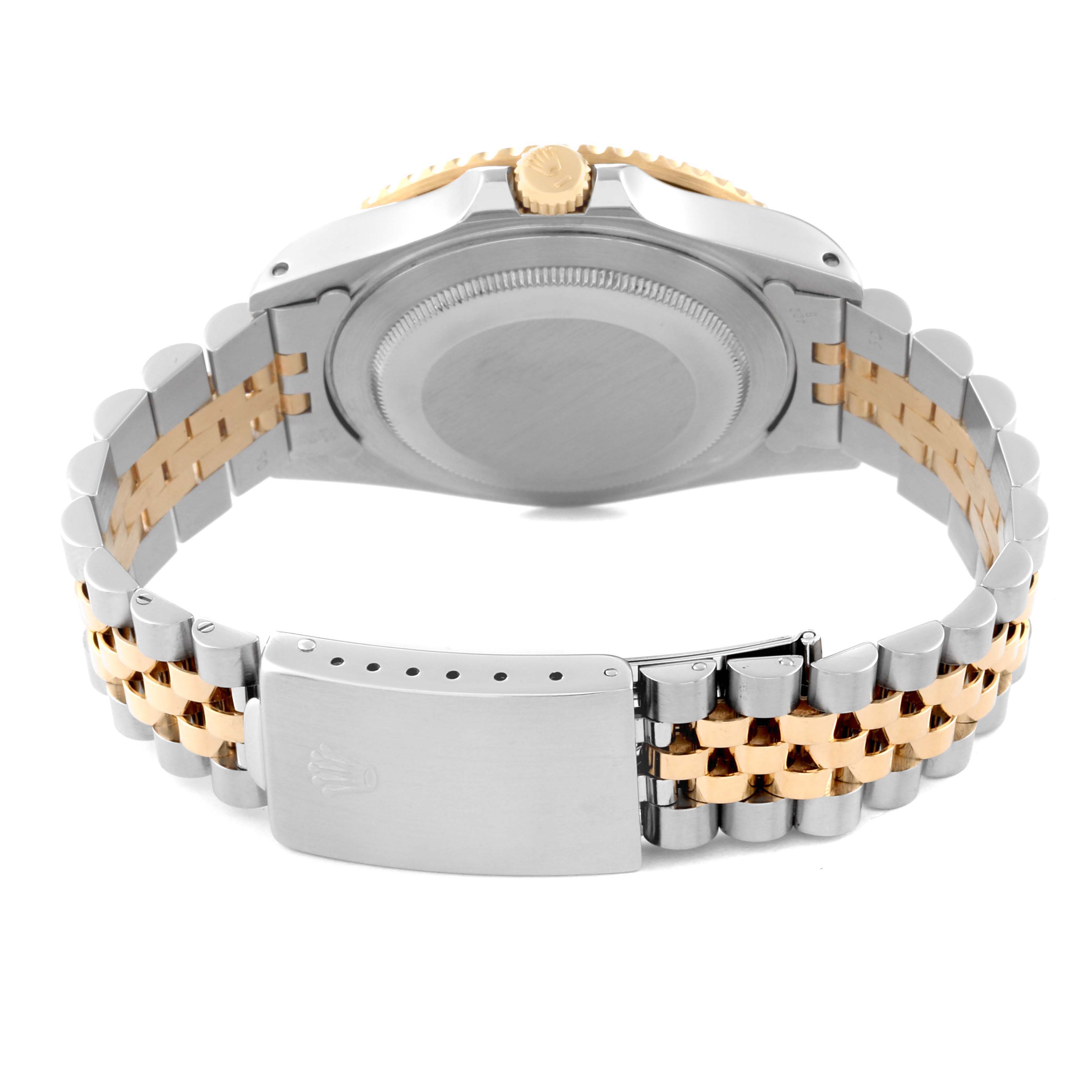 The image shows the back of a Rolex GMT-Master 16713 Men's Steel and Gold (two tone) Black Dial 16713 Men's Steel and Gold (two tone) Black Dial watch, highlighting the case back, crown, and Jubilee bracelet with a two-tone design.