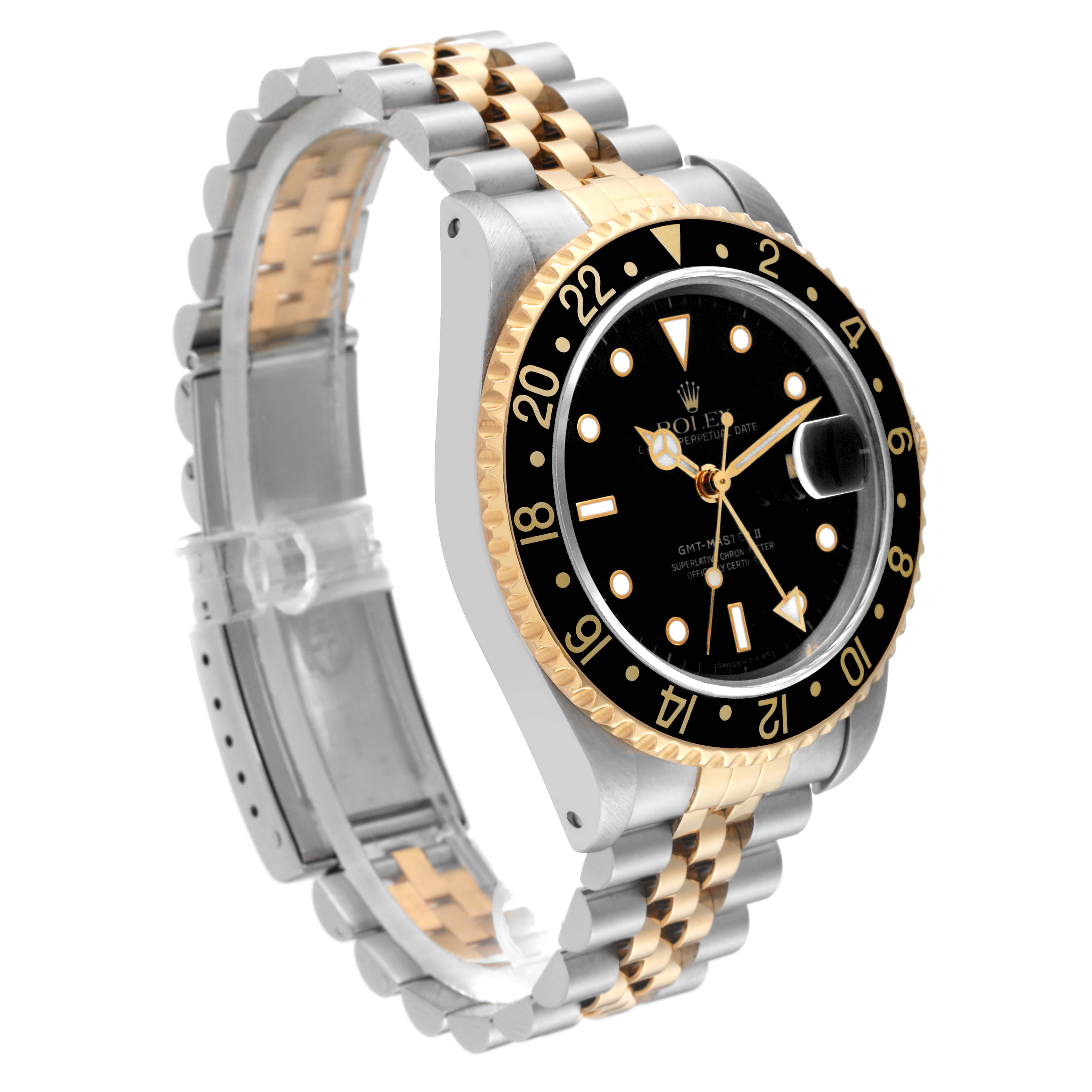 The image shows a Rolex GMT-Master 16713 Men's Steel and Gold (two tone) Black Dial 16713 Men's Steel and Gold (two tone) Black Dial watch at a slight angle, highlighting its two-tone bracelet, black bezel, and dial.