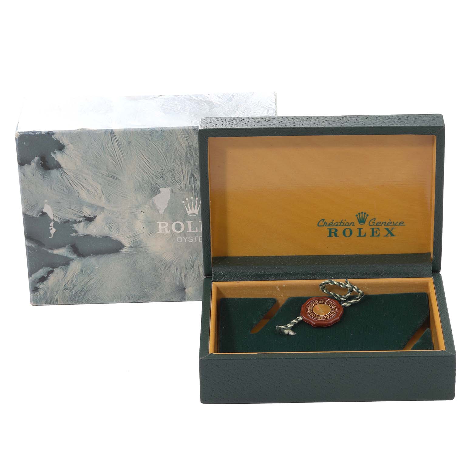 The image shows the box and tag for the Rolex GMT-Master 16713 Men's Steel and Gold (two tone) Black Dial 16713 Men's Steel and Gold (two tone) Black Dial watch, with the box open to reveal the interior.