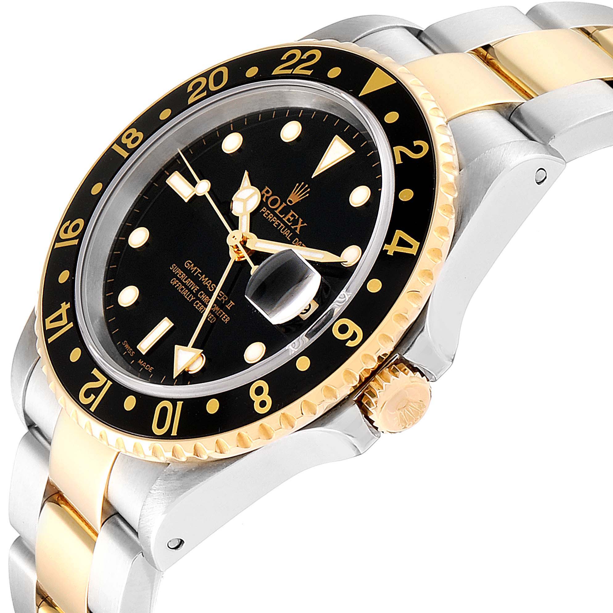 This image shows a Rolex GMT-Master 16713 Men's Steel and Gold (two tone) Black Dial 16713 Men's Steel and Gold (two tone) Black Dial model watch at a side angle, highlighting the bezel, crown, and part of the band.