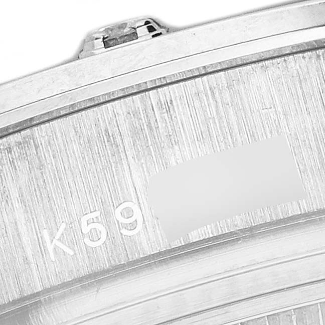 The image shows a close-up side view of the Rolex Pearlmaster 80319 Women
s White Gold Blue Dial 80319 Women
s White Gold Blue Dial watch, highlighting the bezel and a portion of its serial number.