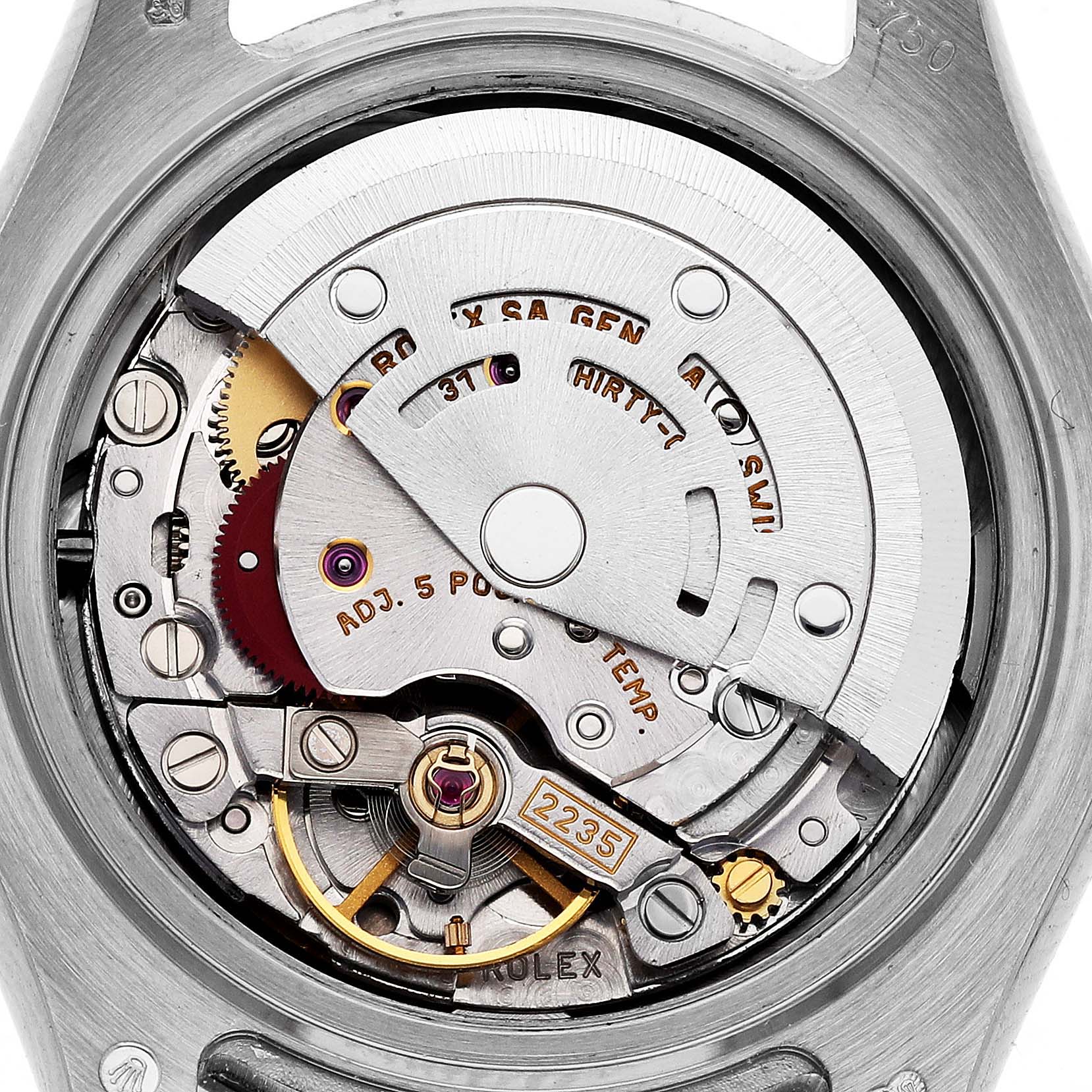 The image shows the internal mechanism of the Rolex Pearlmaster 80319 Women
s White Gold Blue Dial 80319 Women
s White Gold Blue Dial watch from the back, highlighting the movement components.