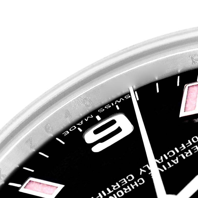 This image shows a close-up, angled view of the dial with part of the bezel of a Mid-Size Rolex watch.