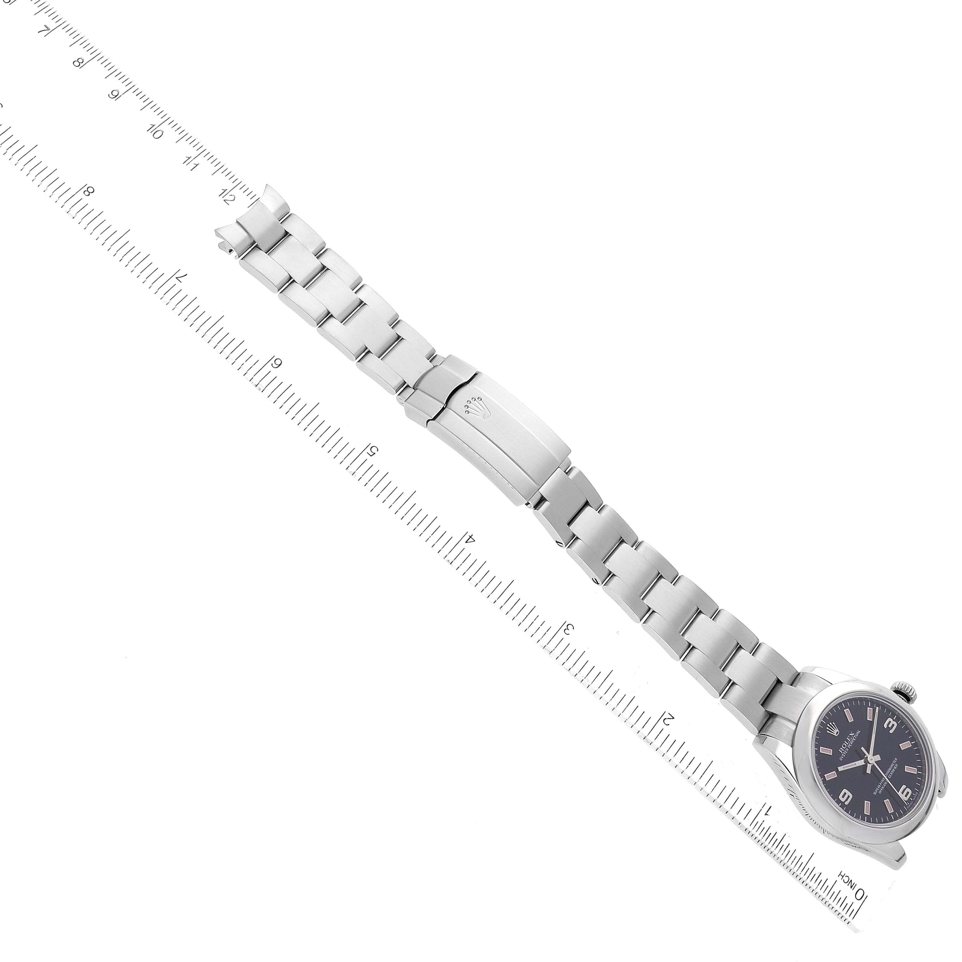 The image shows a top-down view of a Mid-Size Rolex watch with a visible face, bracelet, and clasp.