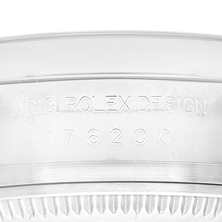 This image shows a close-up of the case back edge of a Rolex Oyster Perpetual 176200 Women's Stainless Steel Silver Dial 176200 Women's Stainless Steel Silver Dial, featuring the engraved model number 176200.