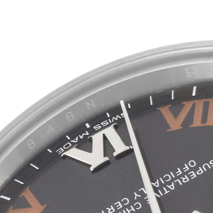 This image shows a close-up of a Rolex Mid-Size 177200 Women's Stainless Steel Grey Dial 177200 Women's Stainless Steel Grey Dial watch face, highlighting the Roman numerals and part of the minute markers.