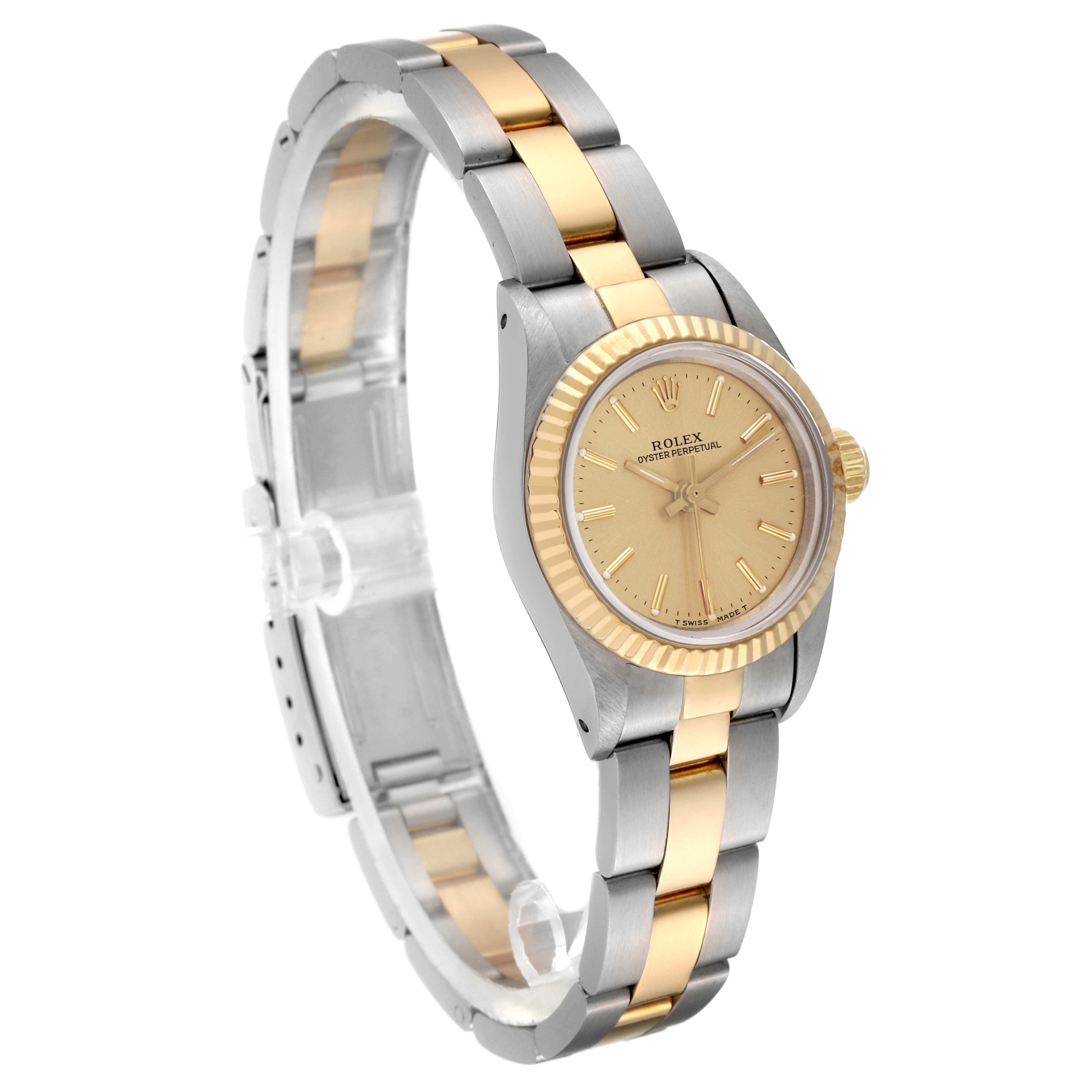 The Rolex Oyster Perpetual 67193 Women's Steel and Gold (two tone) Champagne Dial 67193 Women's Steel and Gold (two tone) Champagne Dial watch is shown at a slight angle, displaying its face, bezel, and two-tone bracelet.